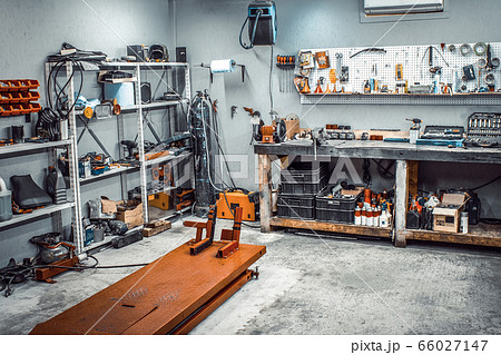 Inside workshop with workbench, shelving, tool kit 66027147