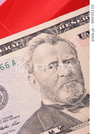 fifty dollar bill in front of the American flag 66030210
