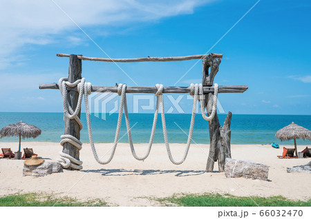 Two Chairs Under Parasol In Tropical Beach Two Chairs Under Parasol In Tropical Beach 66032470