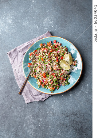 Traditional Lebanese salad tabouli tabule with quinoa, herbs, tomatoes, mint and lemon Traditional Lebanese salad tabouli tabule with quinoa, herbs, tomatoes, mint and lemon 66034041