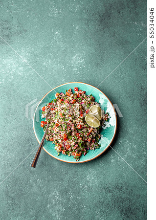 Traditional Lebanese salad tabouli tabule with quinoa, herbs, tomatoes, mint and lemon Traditional Lebanese salad tabouli tabule with quinoa, herbs, tomatoes, mint and lemon 66034046