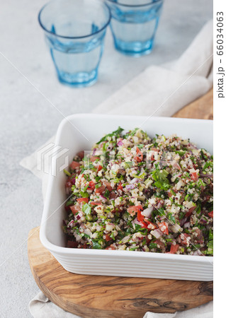 Quinoa Quinua salad with tomatoes and herbs in white bowl Quinoa Quinua salad with tomatoes and herbs in white bowl 66034063
