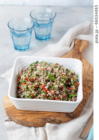 Quinoa Quinua salad with tomatoes and herbs in white bowl Quinoa Quinua salad with tomatoes and herbs in white bowl 66034065