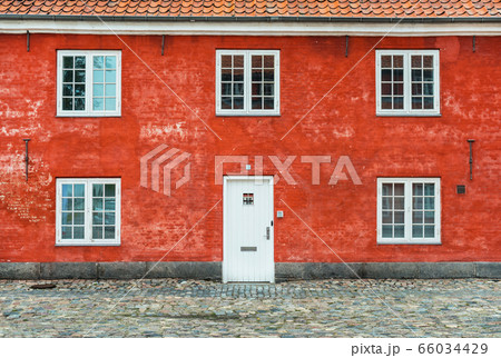 Old red house with white windows and door, Kastellet, Copenhagen, Denmark 66034429