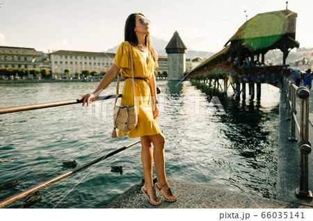 fashion woman in summer dress travelling Europe on 66035141