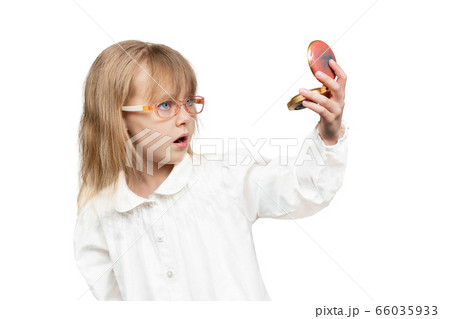 child admires himself in the mirror 66035933