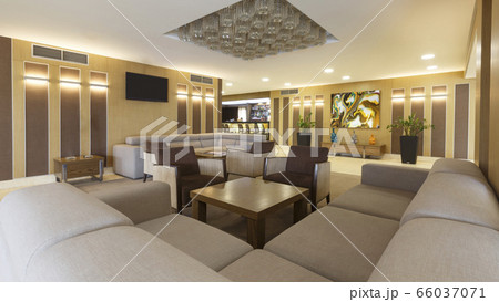 Large sofa, table and plants in hotel lounge 66037071