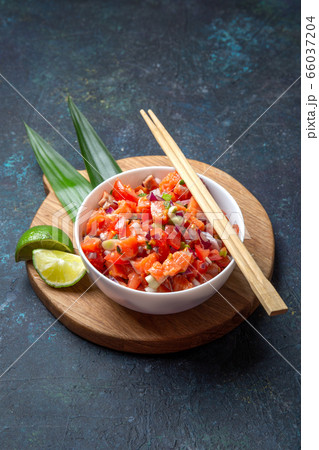 Hawaiian food Salmon Lomi Lomi. Salmon with tomatoes, onion and lemon Hawaiian food Salmon Lomi Lomi. Salmon with tomatoes, onion and lemon 66037204