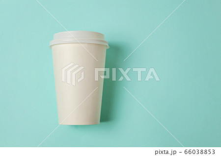 Paper cup of coffee on blue background Paper cup of coffee on blue background 66038853