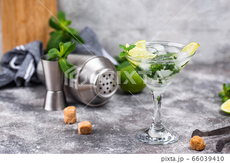 Martini cocktail with lime and mint. Martini cocktail with lime and mint. 66039410