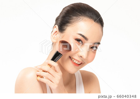 Beauty asian woman hold make up brush and cheerful with make up brush Beauty asian woman hold make up brush and cheerful with make up brush 66040348