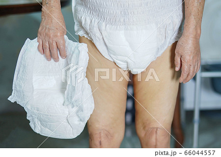 Asian senior or elderly old lady woman patient wearing incontinence diaper in nursing hospital  66044557