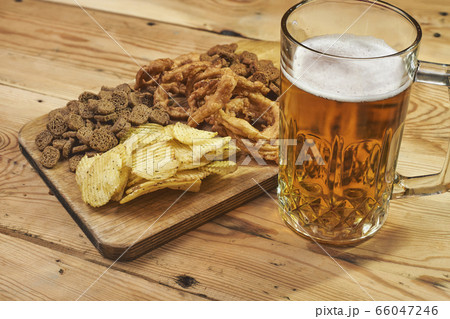 Beer glass and snacks 66047246