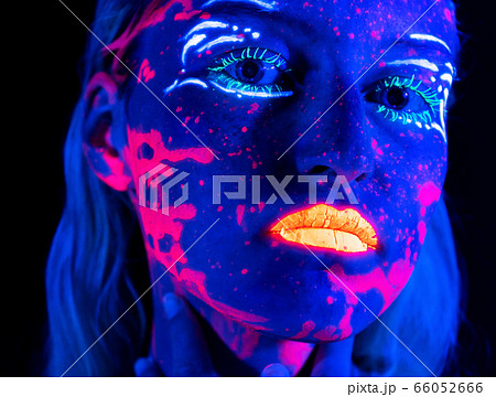 Picture of young girl with bright make-up in neon Picture of young girl with bright make-up in neon 66052666