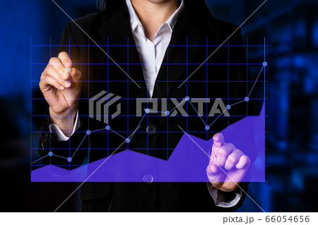 businessman use hand show line graph holographic statistics sales economics company in quarter this year success to investor for reliability. 66054656