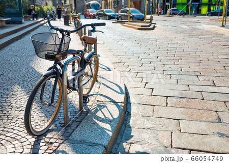 Bicycle parked on city street Bicycle parked on city street 66054749
