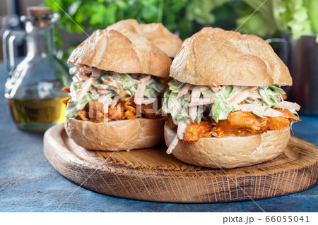 Pulled chicken sandwich with salad and bbq sauce 66055041