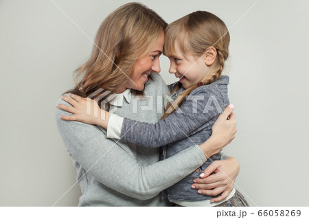 Happy family. Mother and daughter hugging. Happy family. Mother and daughter hugging. 66058269