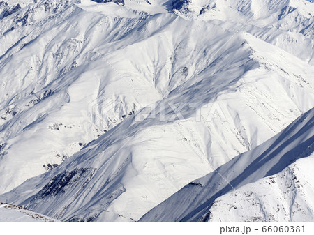 High mountains with sunlit snowy slope at cold 66060381
