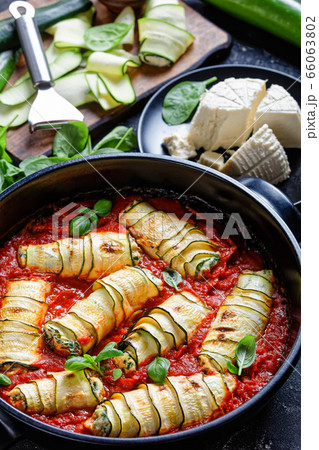 Keto diet dish of rolled zucchini with ricotta 66063802