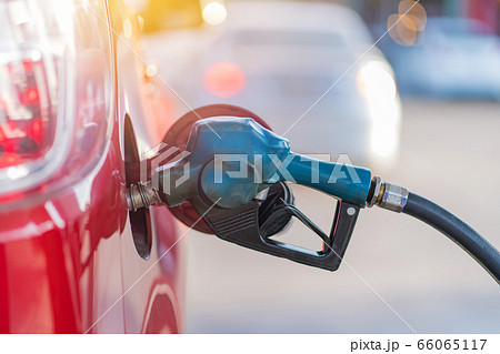 Car refueling on the petrol station with pumping gasoline fuel in car, diesel or gasoline 66065117