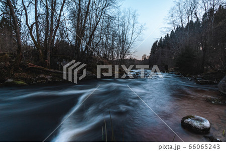 Old foundation of a ruined mill in a fast flowing river in a spring landscape Old foundation of a ruined mill in a fast flowing river in a spring landscape 66065243
