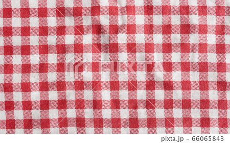 Red linen picnic tablecloth. Texture of a red and white checkered picnic blanket. 66065843