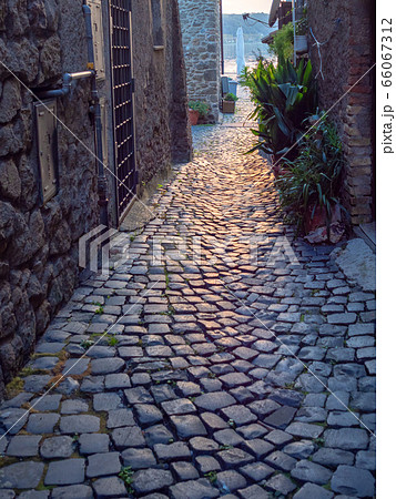Old town street on evening in Italy Old town street on evening in Italy 66067312