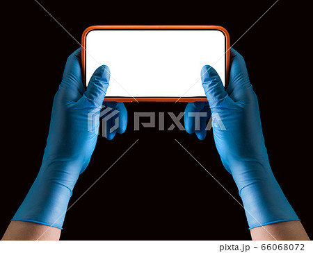 Doctor's hand in medical gloves holding phone and Doctor's hand in medical gloves holding phone and 66068072