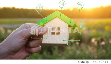 Miniature house and symbols of public utilities. Choosing a home to buy, assessing the cost and condition of the building. Location in the city. Repair and renovation, maintenance services. 66070243