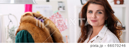 Seamstress working in studio 66070246