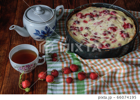 Breakfast with strawberry pie, black tea and berries 66074195