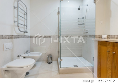 Modern bathroom with glass shower. European hotel design. Close-up. 66074412