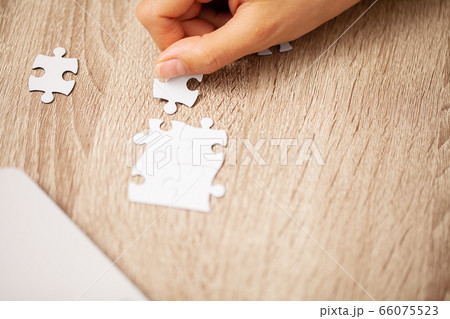 Business success concept, woman makes up puzzle 66075523