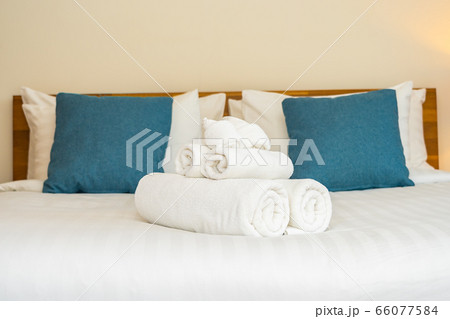 White clean bath towel on bed decoration interior 66077584