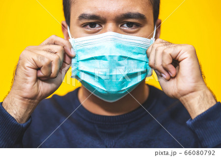 Man is wearing masks to protect against Corona virus 66080792
