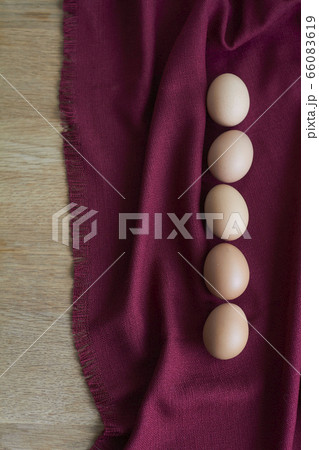 Natural eggs on wooden table, several brown 66083619