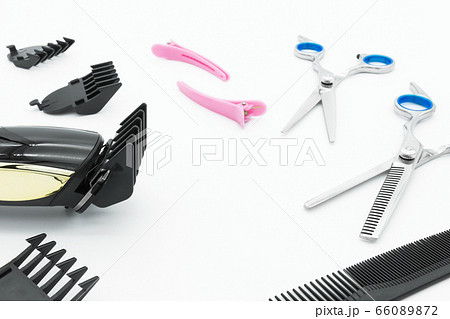 Hair scissors set hairdressing tools with cordless electric hair clipper are isolated on white background. 66089872