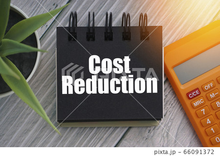 COST REDUCTION text with calculator, decorative 66091372
