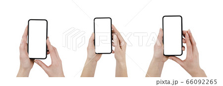 Hand holding old black smartphone isolated on white background. (Clipping path) 66092265