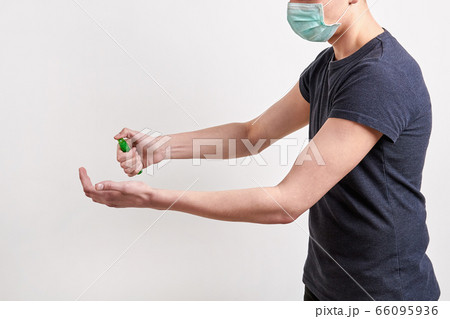 Man in dark shirt and protective medical mask is Man in dark shirt and protective medical mask is 66095936