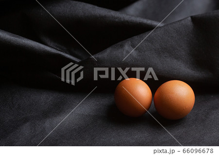 Eggs on black fabric background Eggs on black fabric background 66096678