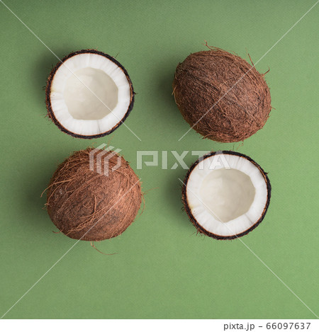 Coconuts on the green background. Coconuts on the green background. 66097637