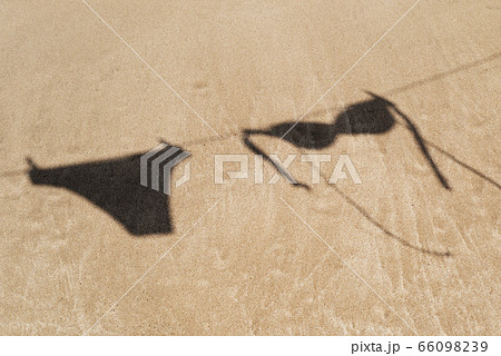 bikini hanging on a clothes line on the beach bikini hanging on a clothes line on the beach 66098239
