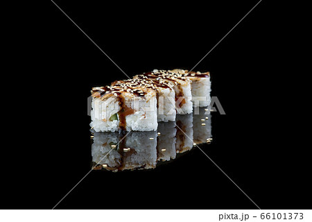 Close Up Of Sushi Roll On A Black Background . Japanese dish . 66101373
