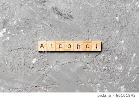alcohol word written on wood block. alcohol text alcohol word written on wood block. alcohol text 66101945