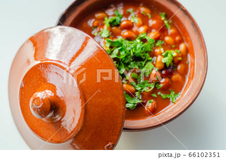A hearty serving of baked beans in a ceramic dish, A hearty serving of baked beans in a ceramic dish, 66102351