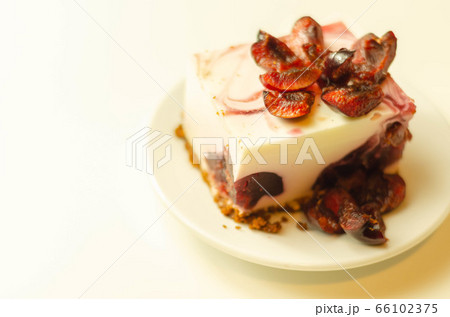 Japanese cheesecake with cherry sauce and fresh Japanese cheesecake with cherry sauce and fresh 66102375
