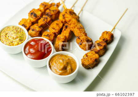 Satay chicken breast marinated in Indonesian style Satay chicken breast marinated in Indonesian style 66102397