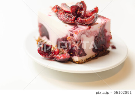 Japanese cheesecake with cherry sauce and fresh Japanese cheesecake with cherry sauce and fresh 66102891